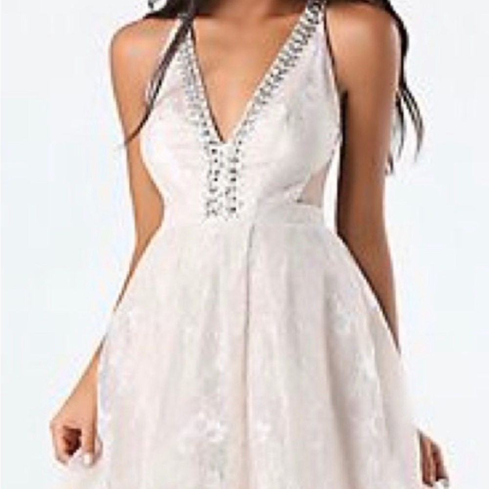 Elegant Sleeveless Dress with Silver Accents, Fit and Flate BeBe